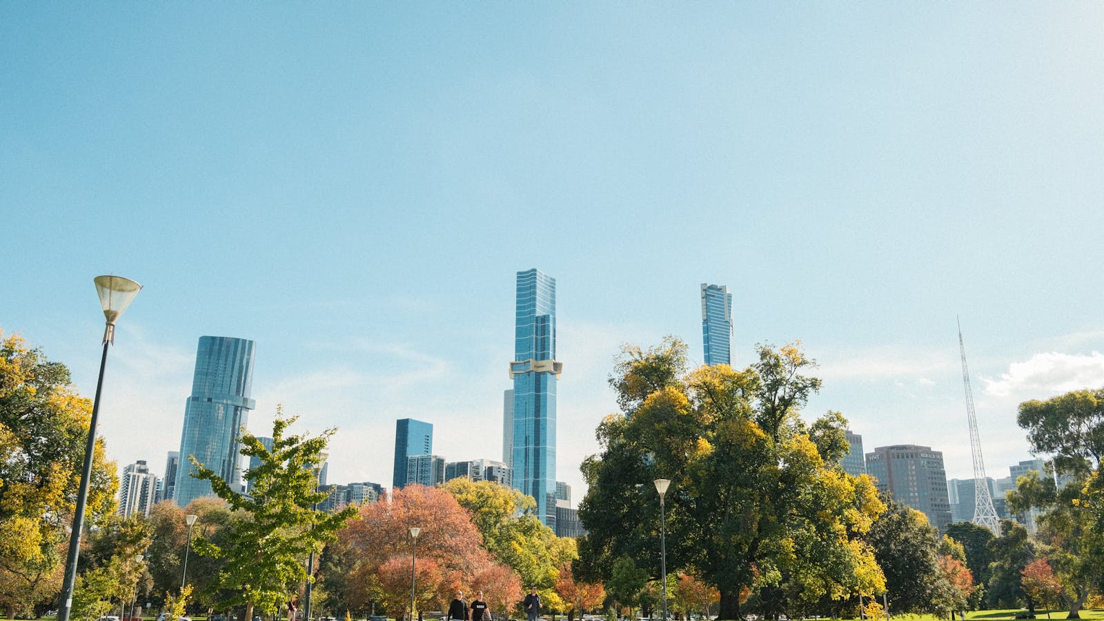Autumn in Melbourne — Queen Victoria Gardens with golden leaves and CBD skyline