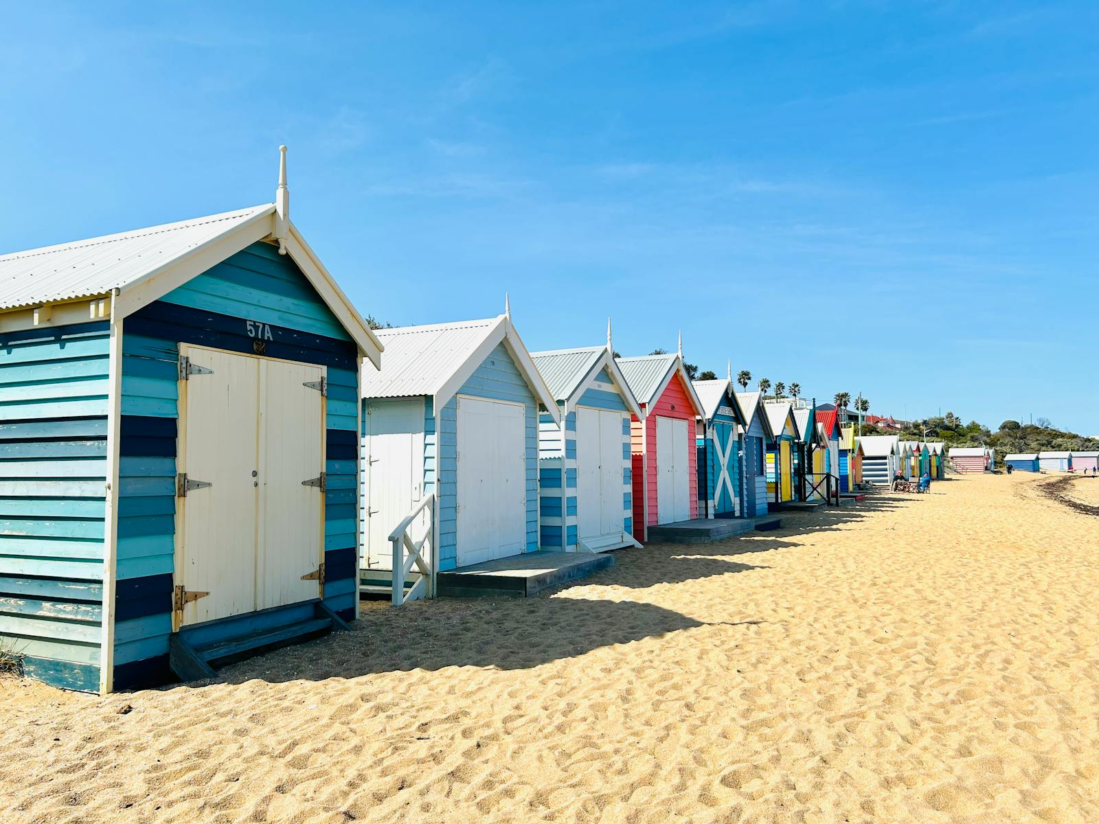 Best time to visit Melbourne in summer — Brighton Bathing Boxes on a hot January day