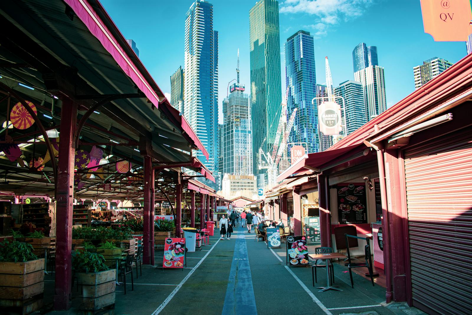 Queen Victoria Market stalls with the Melbourne skyline in the background