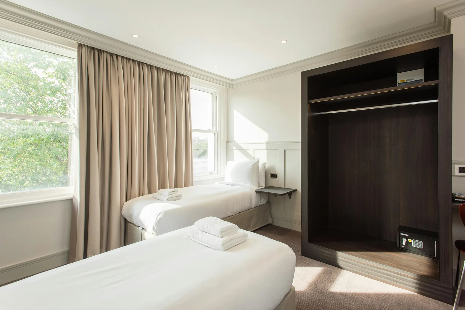 A clean, modern budget hotel room in Melbourne