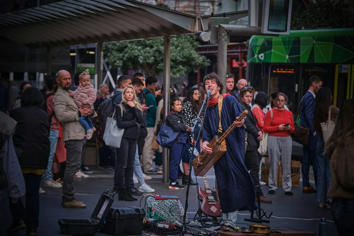 A street performer entertaining crowds in Bourke Street Mall Melbourne