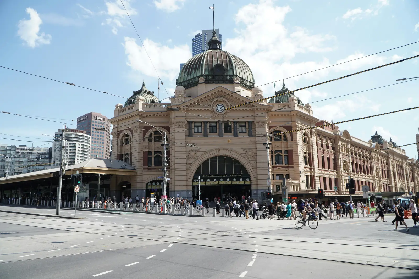 Crowds and a tram in the pedestrian Bourke Street Mall in Melbourne