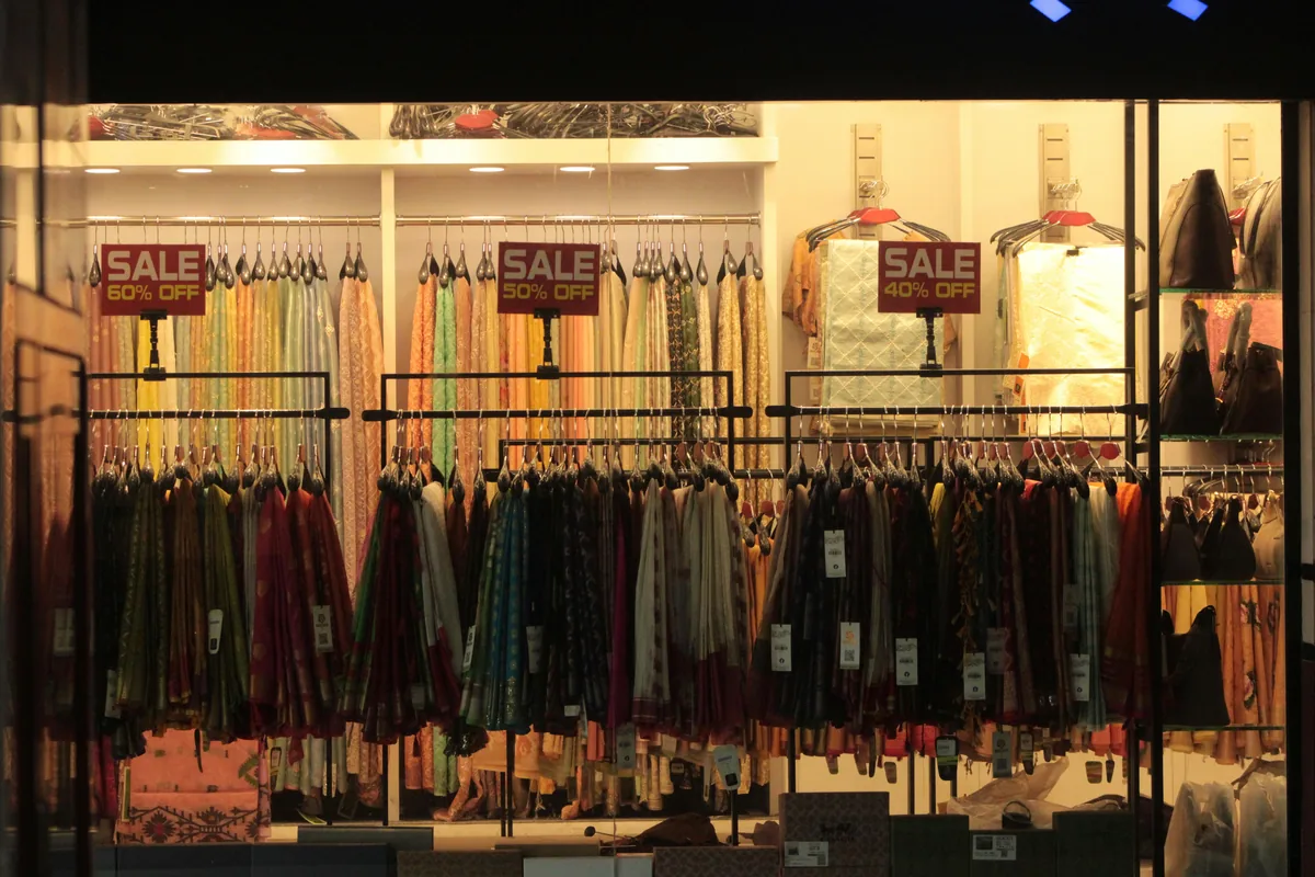 Discounted designer clothing on racks at a Melbourne outlet