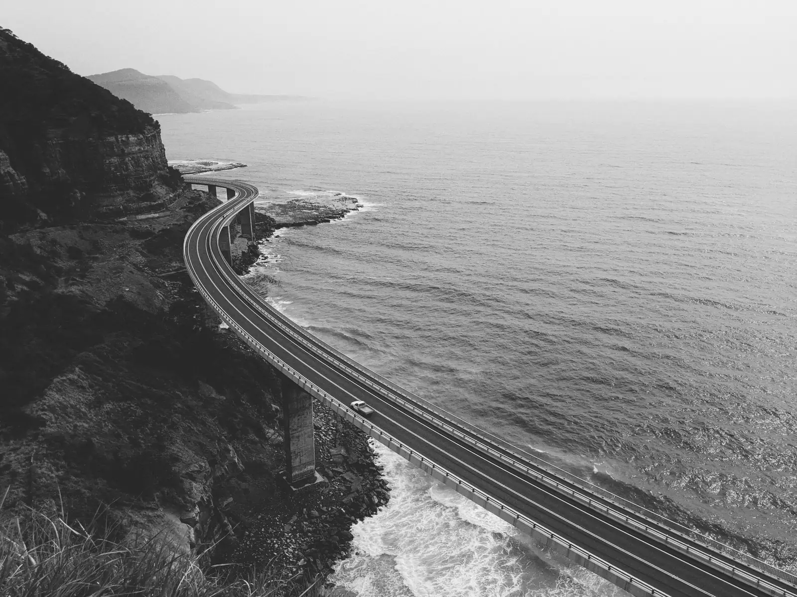 A car on a scenic coastal road near Melbourne