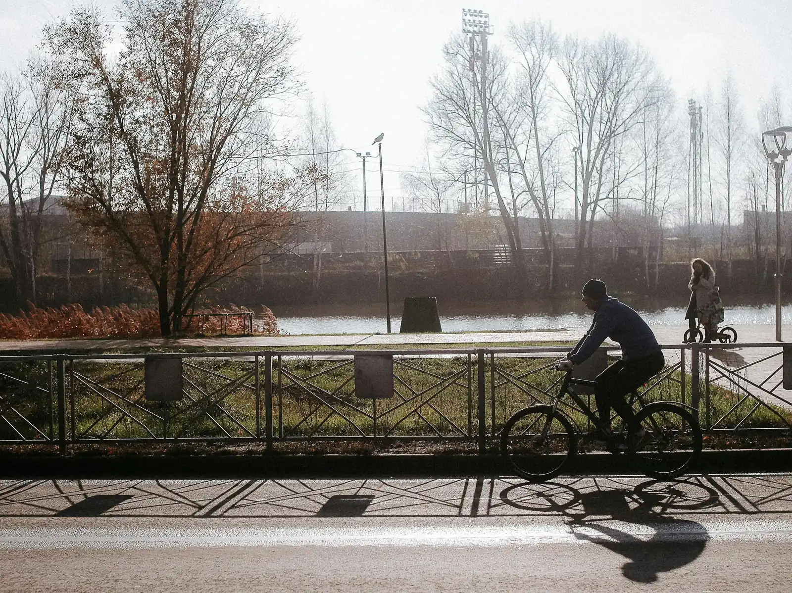 A cyclist on a riverside shared bike path in Melbourne