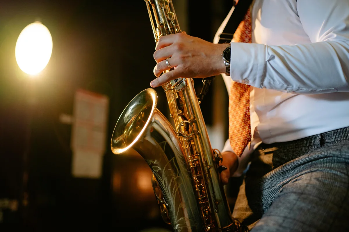 A jazz musician playing saxophone in an intimate Melbourne club