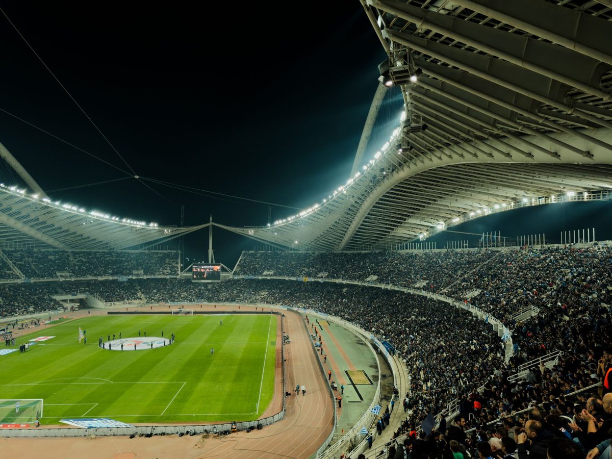 A packed football stadium crowd