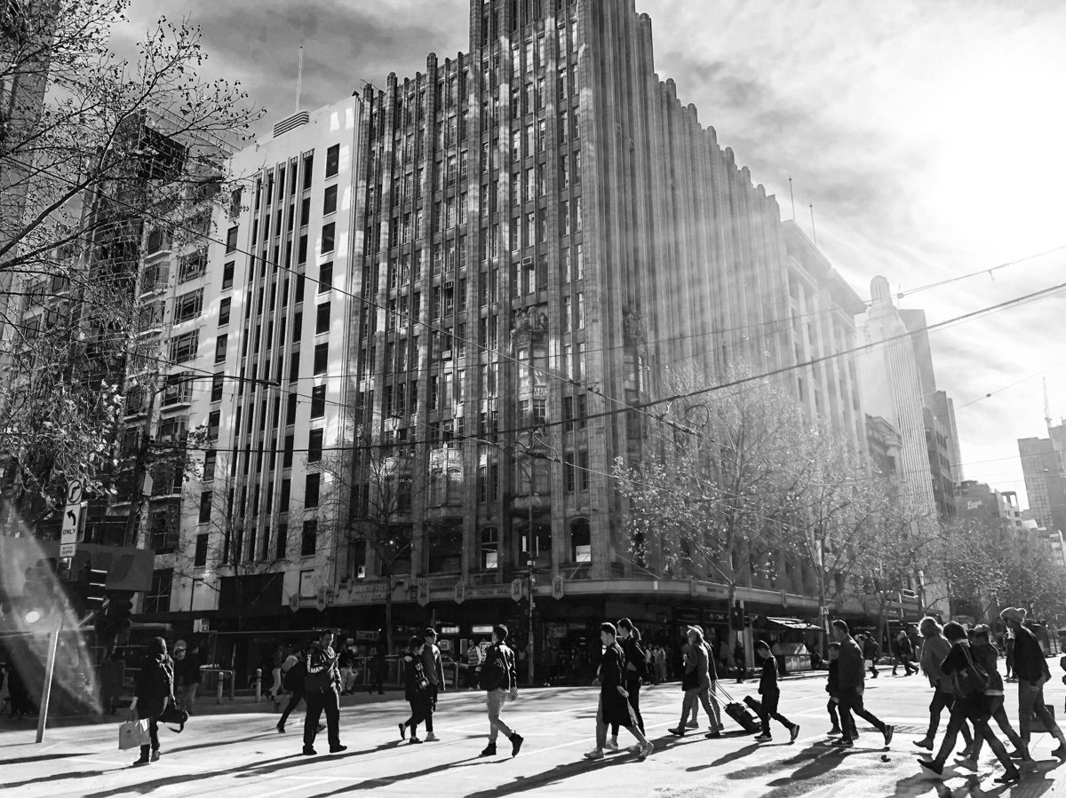 Pedestrians in Melbourne's CBD by day