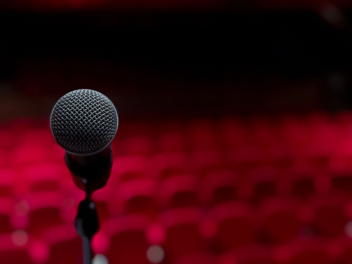 A microphone on a comedy club stage