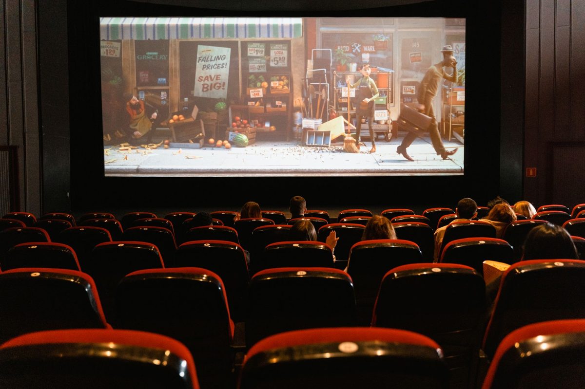An audience watching a cinema screen