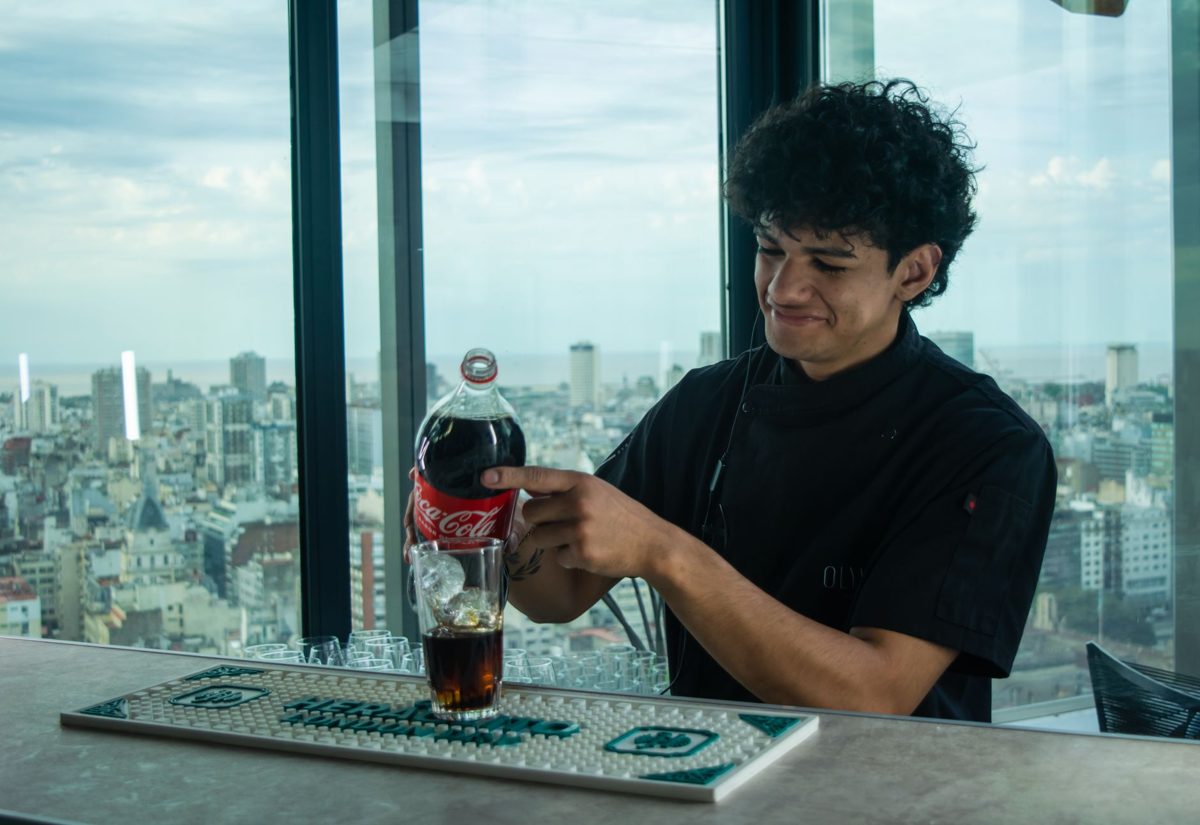 A rooftop bar overlooking the city skyline