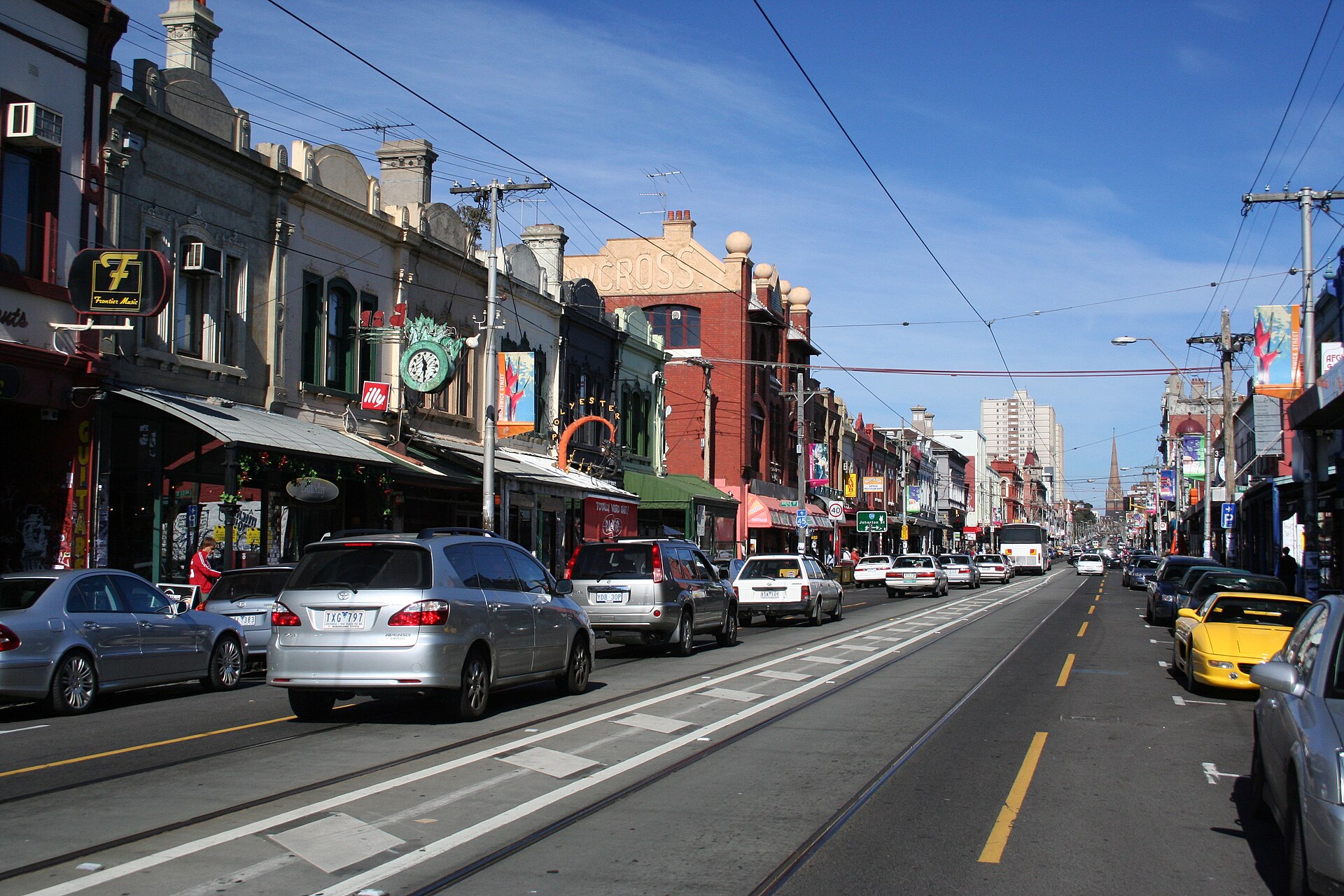 Shopfronts and tram tracks along Brunswick Street in Fitzroy, Melbourne