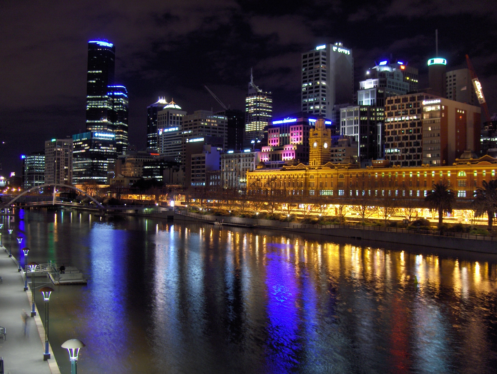 Melbourne city skyline at night reflected in the Yarra River